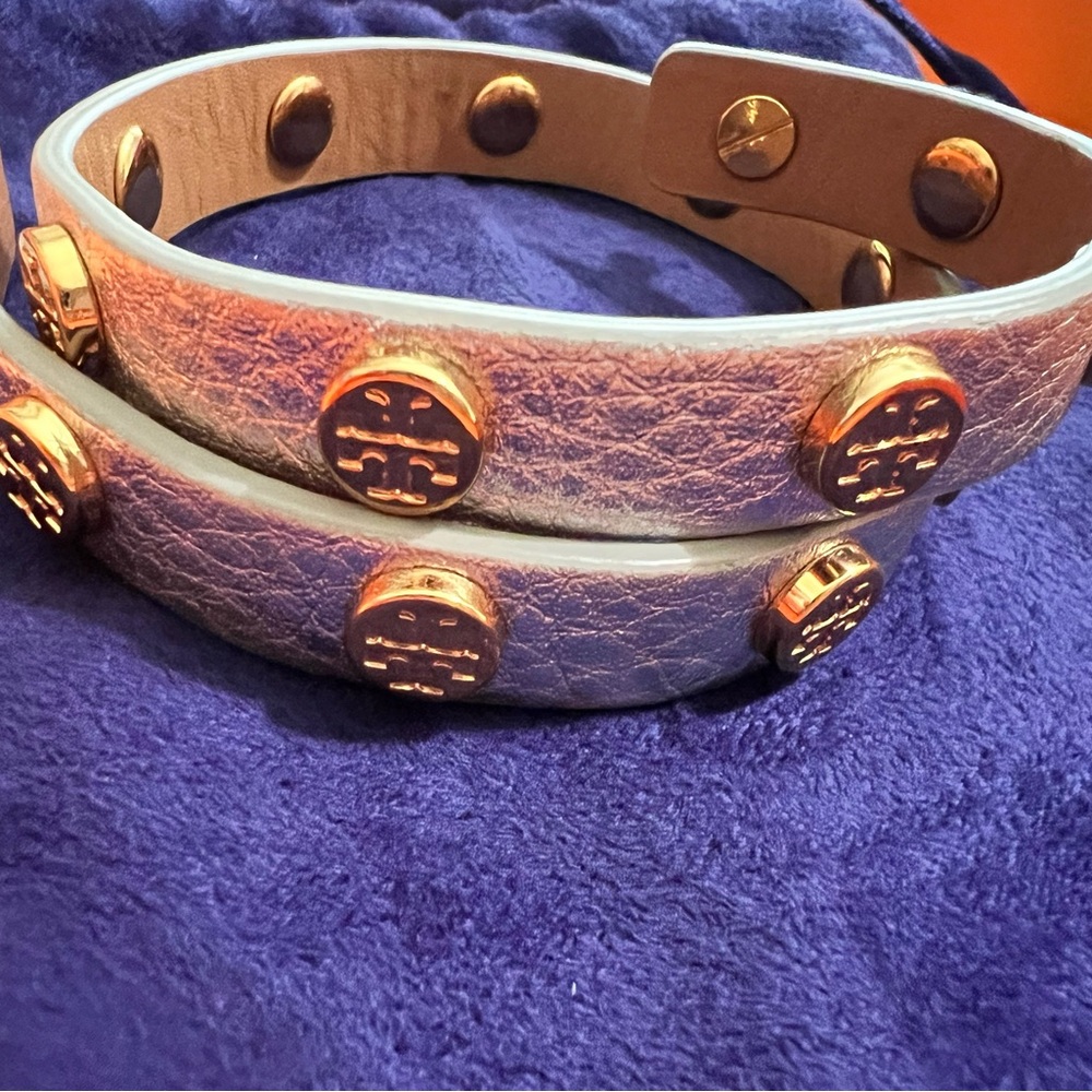 Torry Burch wrap leather bracelet silver with gold stud icons in good condition.